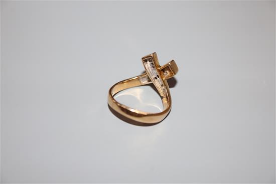 A modern 585 yellow metal and diamond set X ring, size H, gross 4.3 grams.